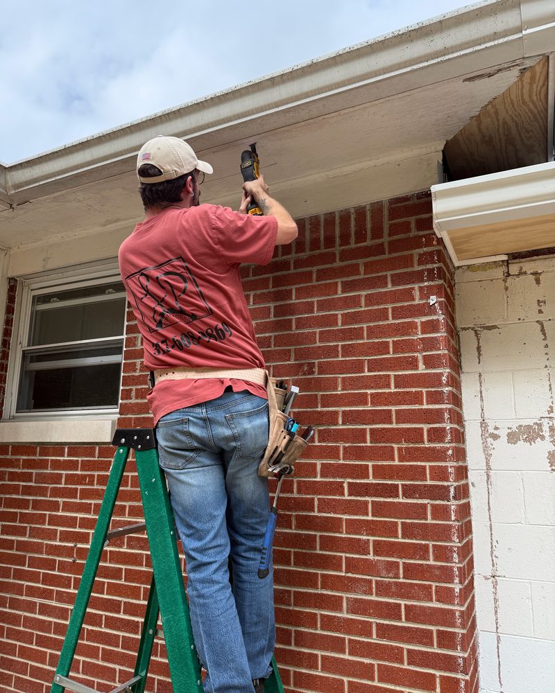 LP Contracting repairing a soffit on a brick home